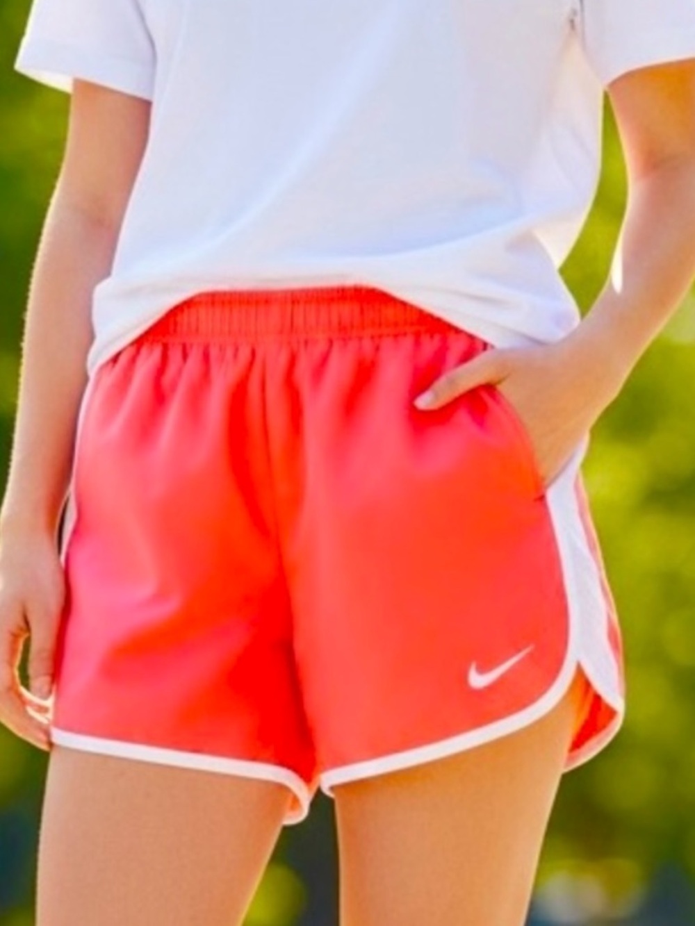 Nike shorts in coral/orange with white trim. Sz S